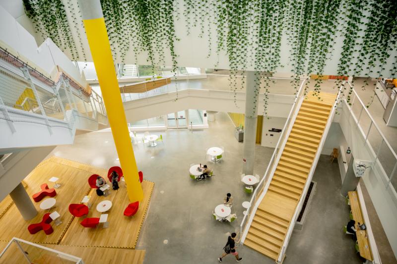 An image of a large social space with stairs leading off to the distance