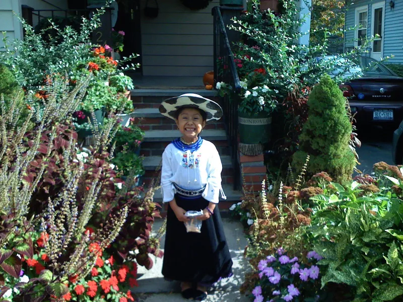 Author standing in front of her home