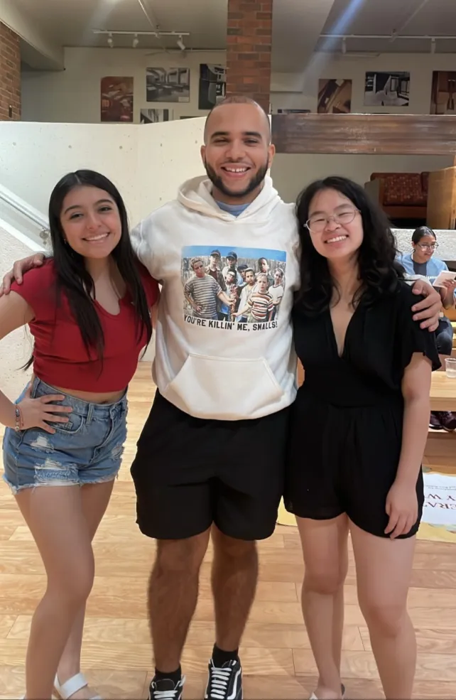 Picture of three students standing in front of First-Gen Visibility Week programming.