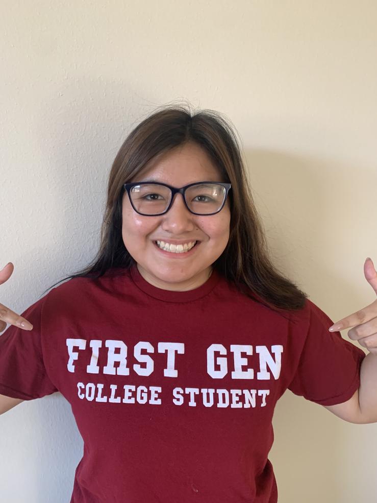 Picture of Kathleen wearing the "First Gen College Student" shirt.