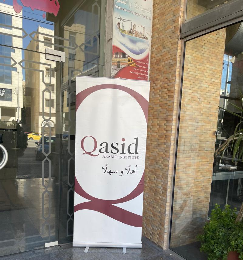 A placard at the entrance of Qasid Arabic Institute in Amman