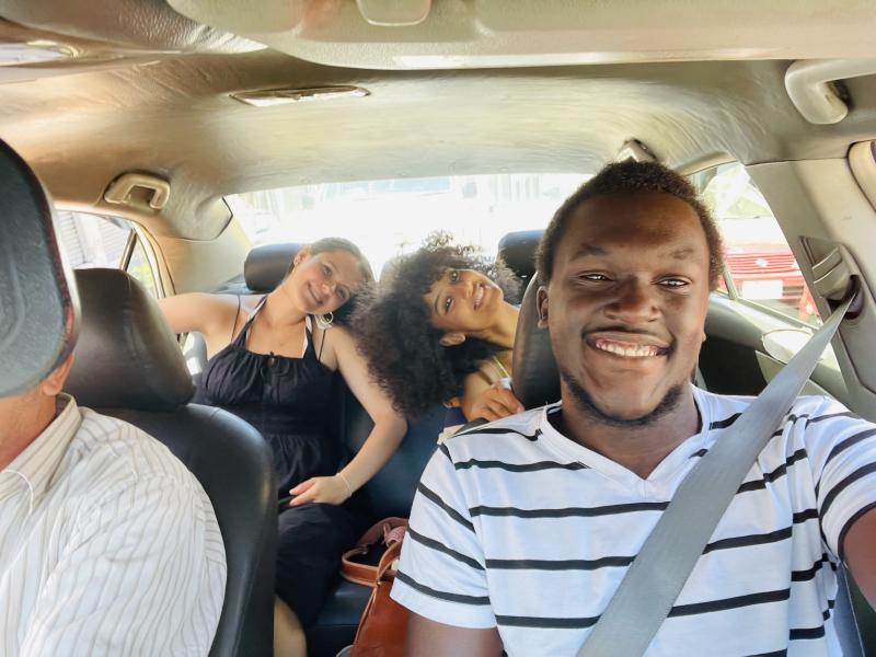 A selfie of writer with two fellow students in a car