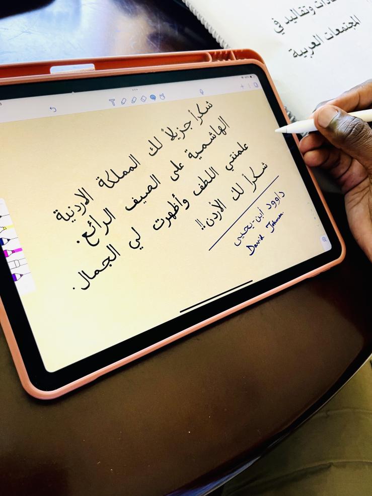 A photo of the writer&#039;s iPad screen with his writing in Arabic