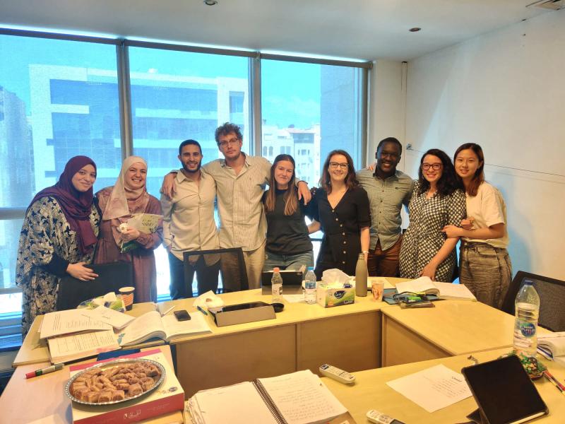 A photo of writer, professor, and classmates in a classroom