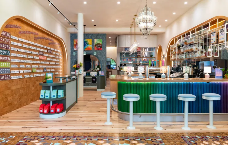 The interior of Life Alive Cafe with a bar table setting