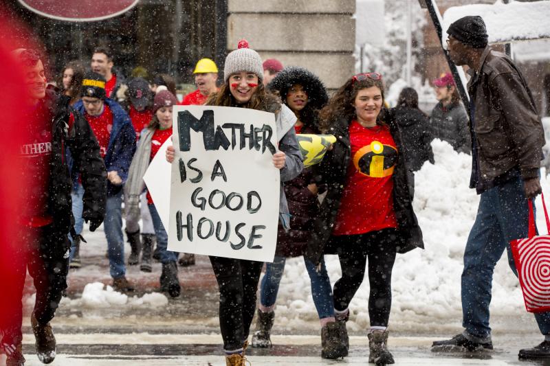 Students carrying poster saying "Mather is a Good House"