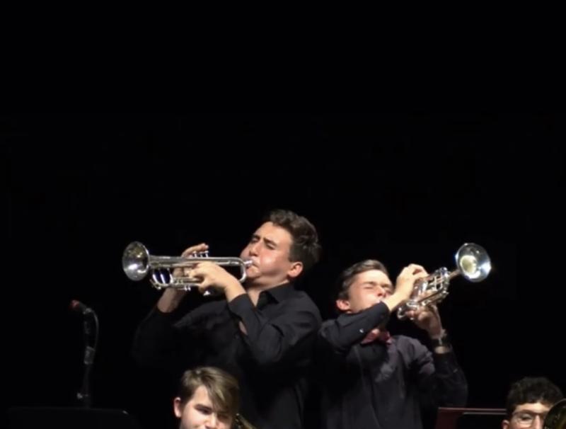 Two people playing the trumpet