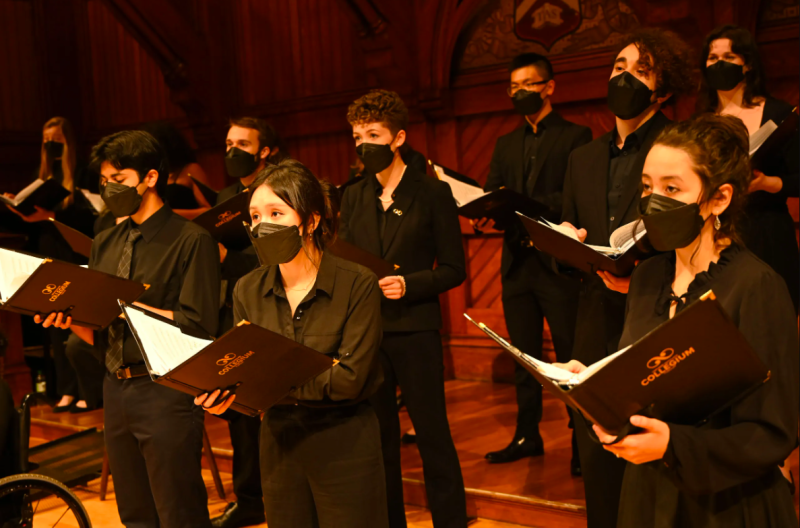 A picture of the author and fellow singers standing and performing