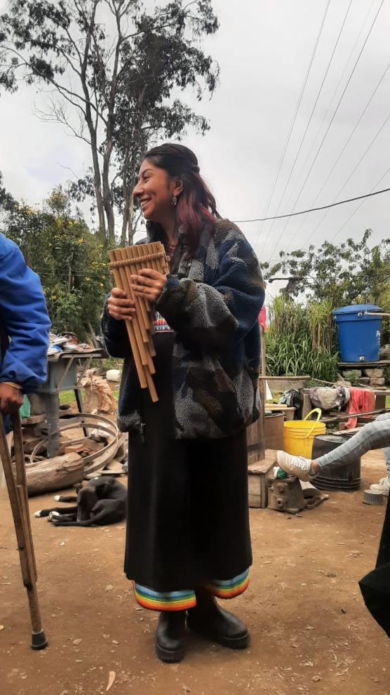 Author holding wooden flute