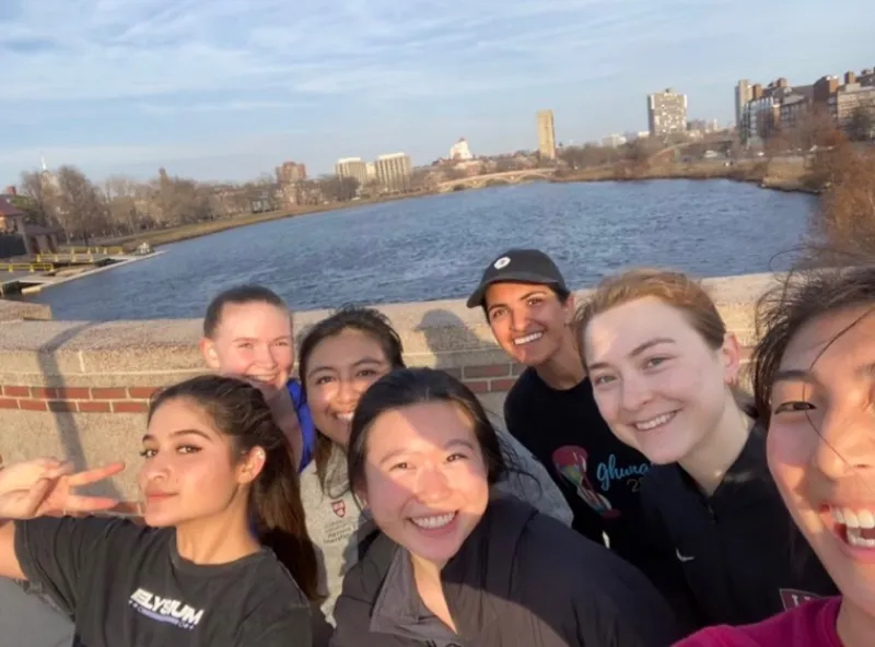 Group selfie on a bridge by the river