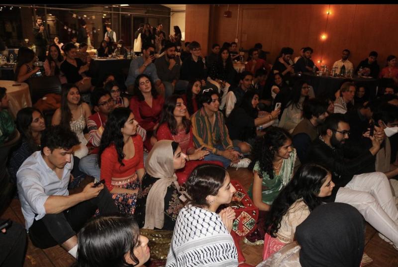 Students enjoying student performances at Chaand Raat