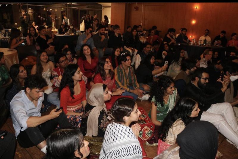 Students enjoying student performances at Chaand Raat