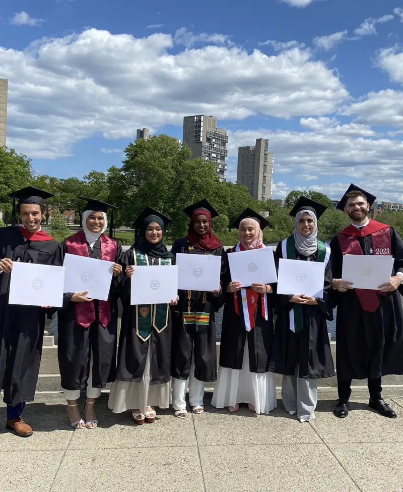 Graduating Seniors with their College Diploma