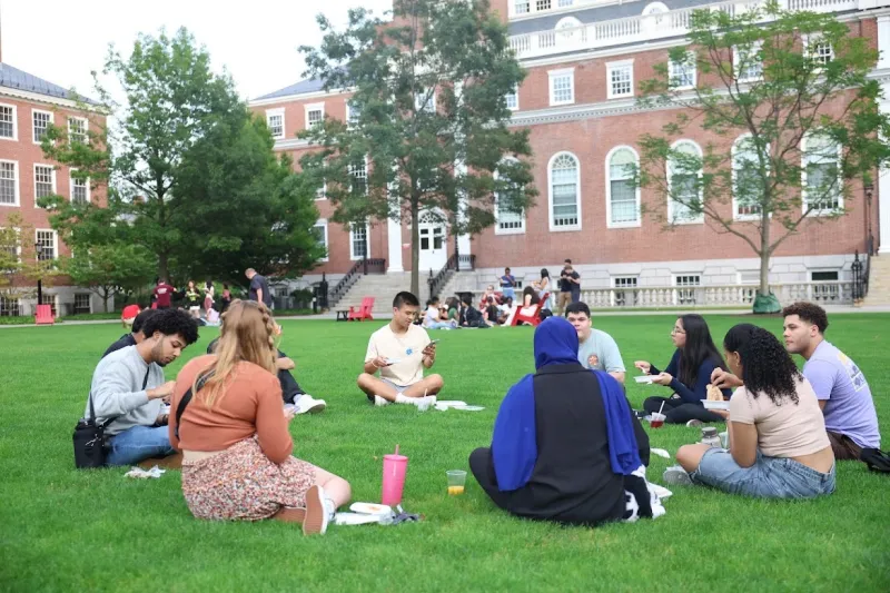 FYRE families having dinner together in Radcliffe Yard