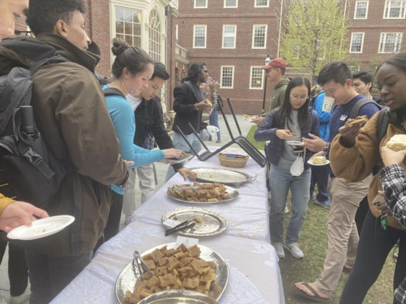 Student enjoying tea and backed goods at Lowell Tea