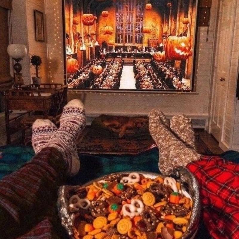 Two people eating Fall-themed snacks, while watching a movie pc: The Lexington Line