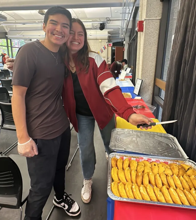 Student board members helping set up