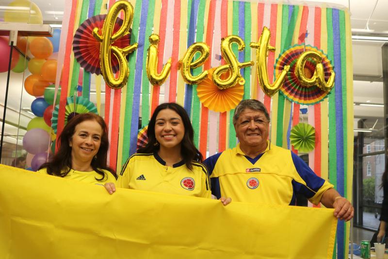 Alejandra Beltran posing for a photo with her parents
