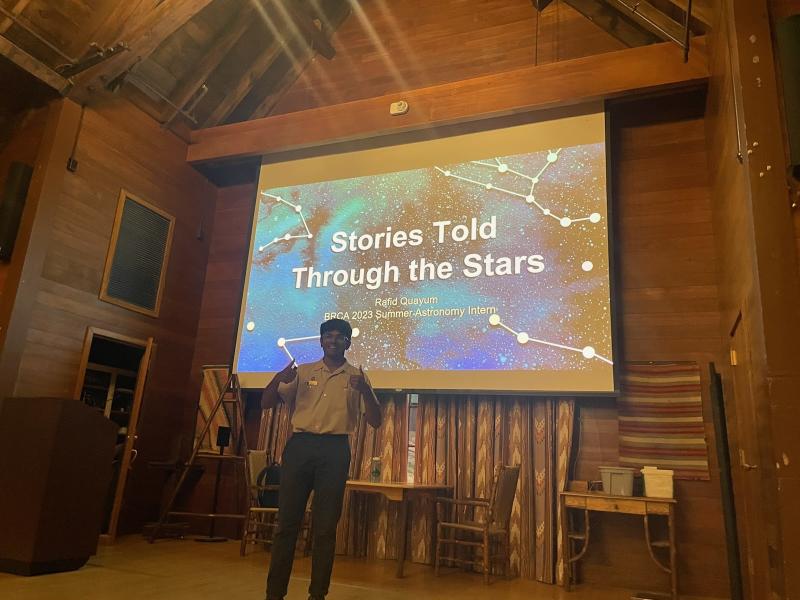 Rafid standing in front of his presentation at Bryce Canyon National Park