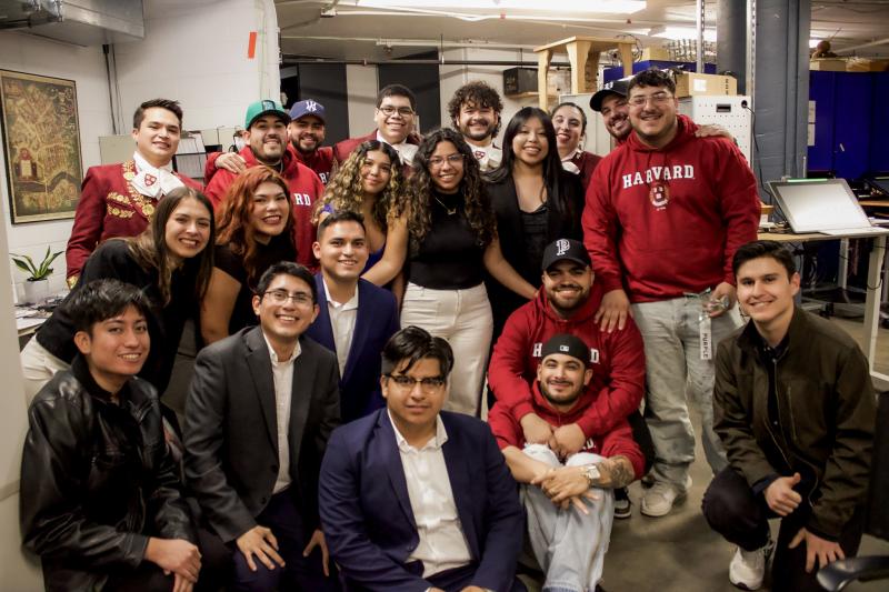 Grupo Frontera with Mariachi band members and RAZA board backstage. 