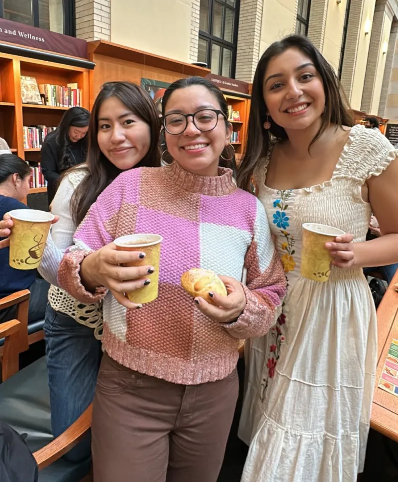 Attendees Enjoying Pan De Muerto and Hot Chocolate