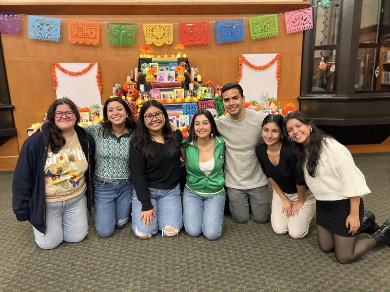 Fuerza Latina Club Members Posing in Front of the Completed Altar