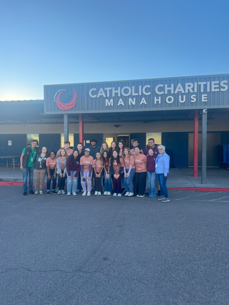 Group Photo standing in front of Catholic Charities Mana House