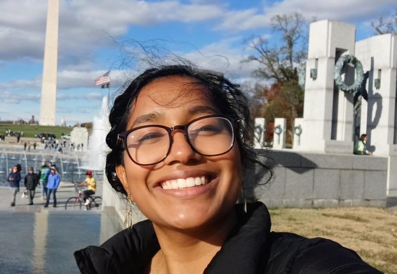 Merlin smiling in front of The Washington Monument 