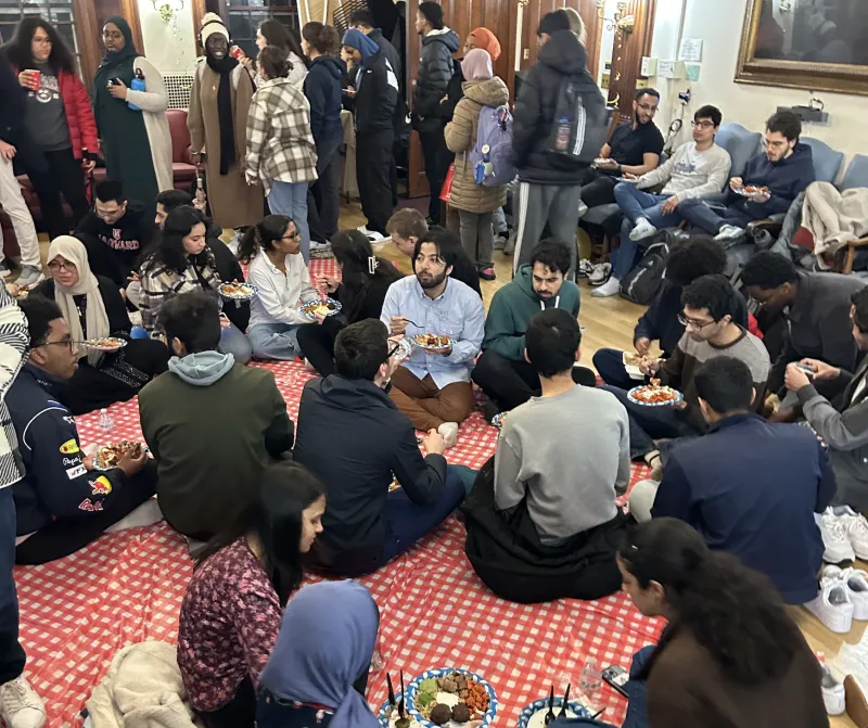 Students eating iftar at the Phillips Brooks House