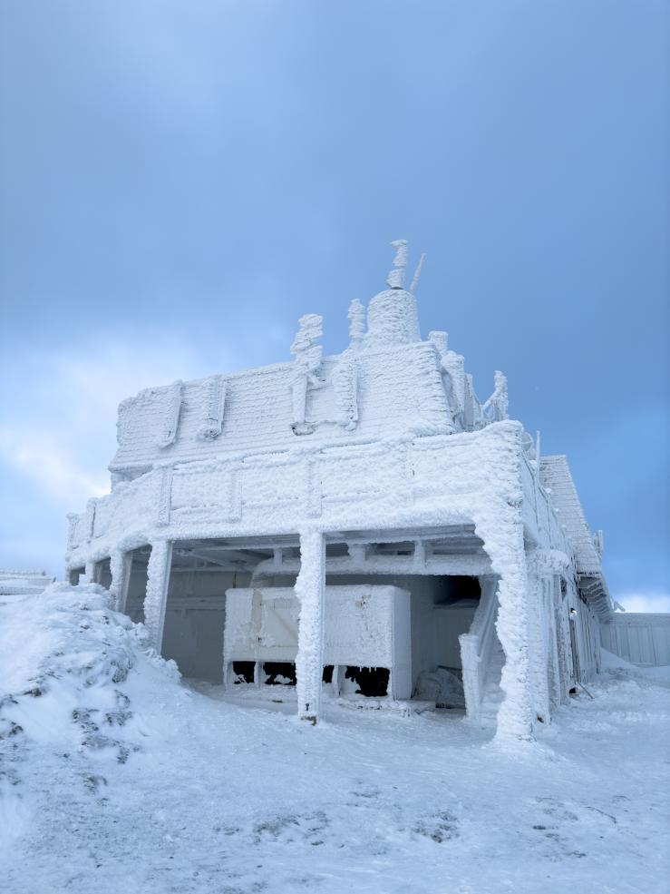 Building at the mountain top covered with snow.