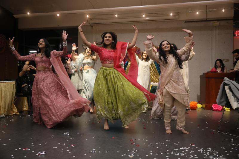 The "Bride's Side" performing dances at Mock Mehndi.