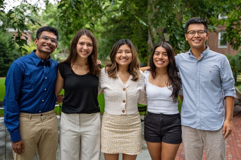 A group of five students, the Harvard First Generation Program Coordinators. From left to right: Rafid, Ana, Kathleen, Emily, and Raymond.