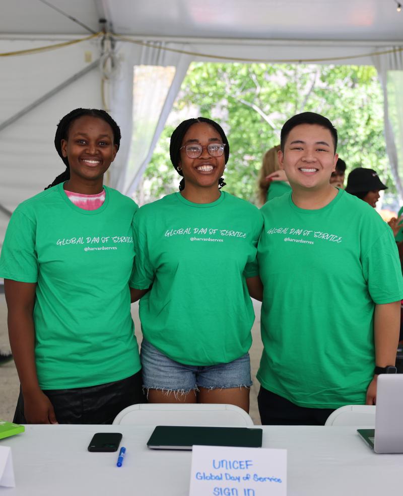 Harvard UNICEF student leaders at their table, ready to sign in volunteers for the Global Day of Service project planned for the afternoon.