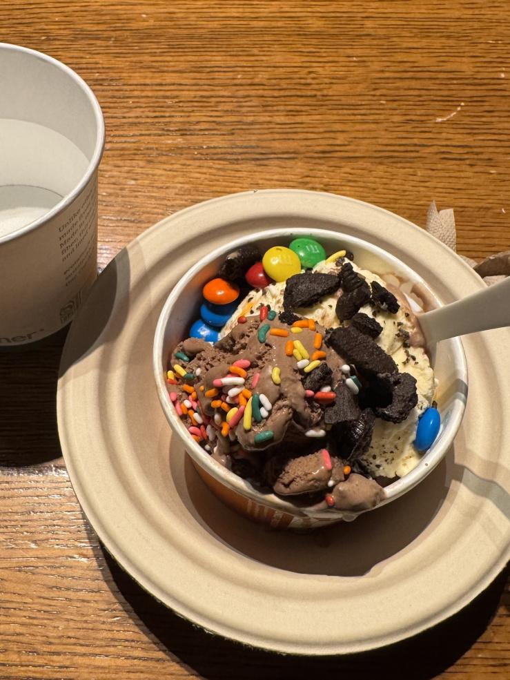 An ice cream sundae from brain break with sprinkles, chocolate, and Oreos on top. 