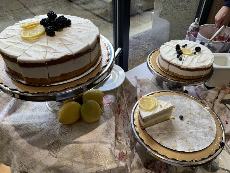 Picture of lemon pie served in the Currier House dining hall with lemon slices and berries as garnish.