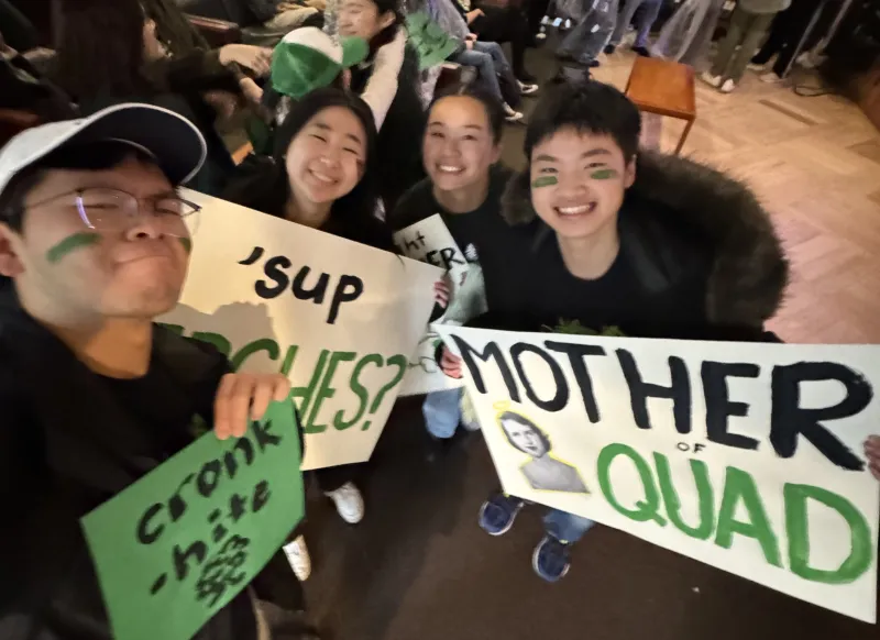 Group picture of the author and his blocking mates holding up Currier-themed Housing Day signs and posters.