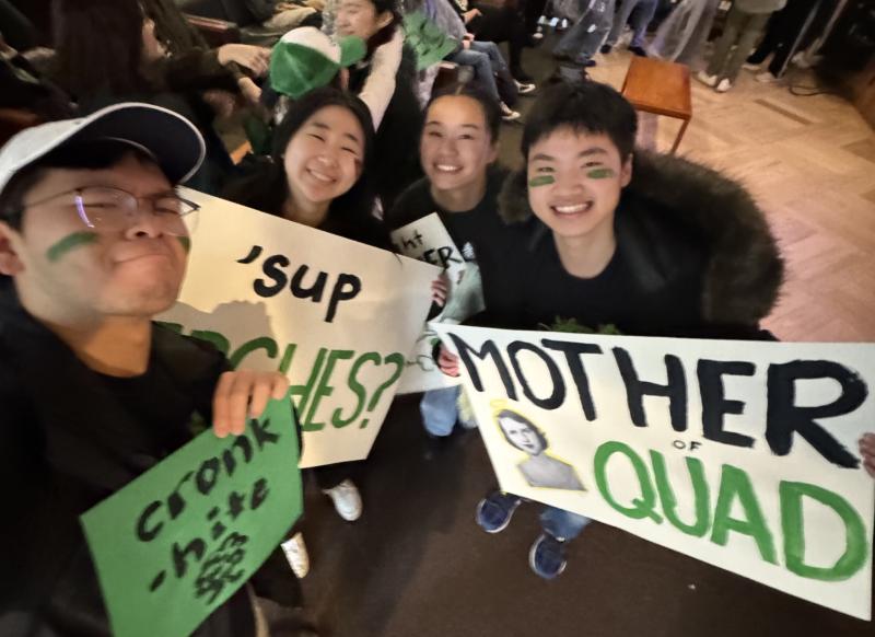 Group picture of the author and his blocking mates holding up Currier-themed Housing Day signs and posters.