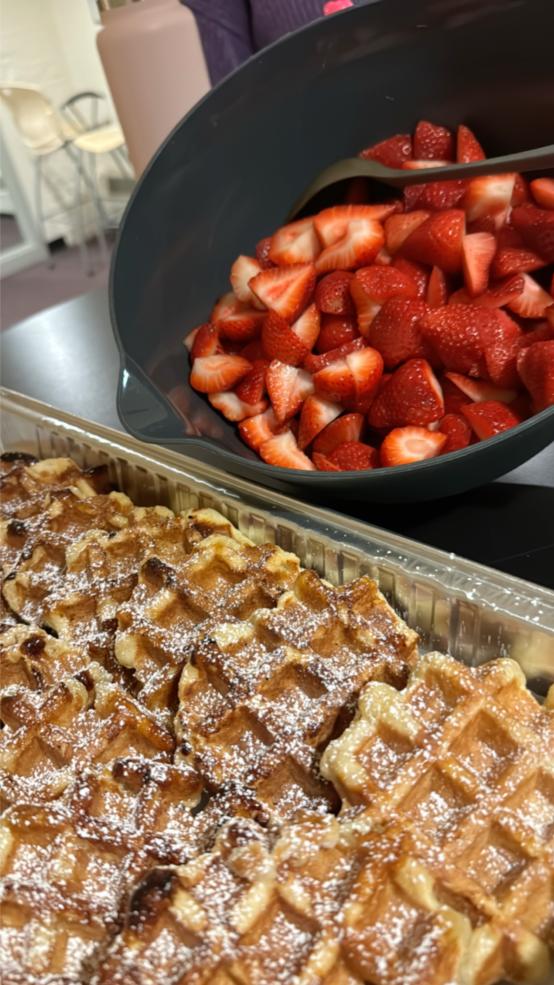 Waffles with powdered sugar and fresh strawberries