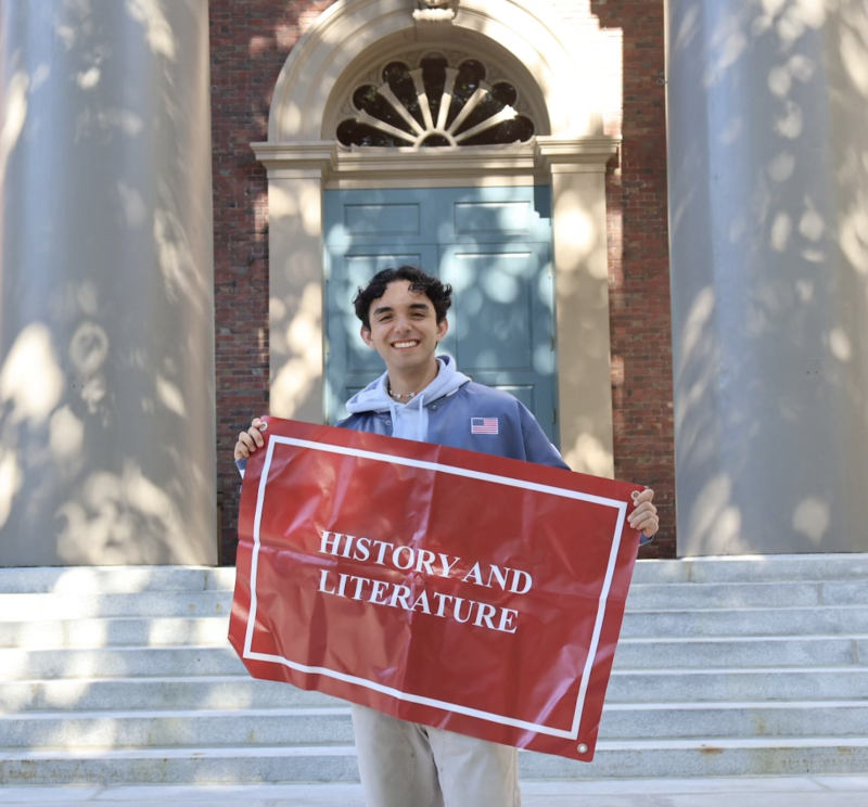 A 2nd Year Student Posing with a History of Literature poster