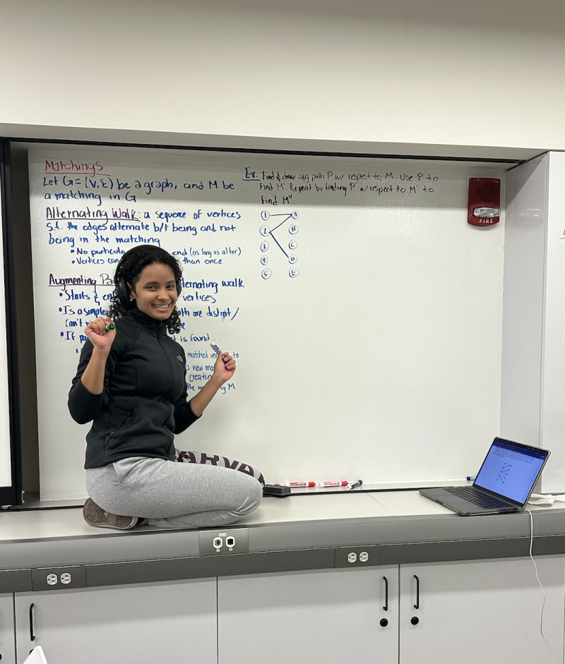 Student Doing Work on A Whiteboard