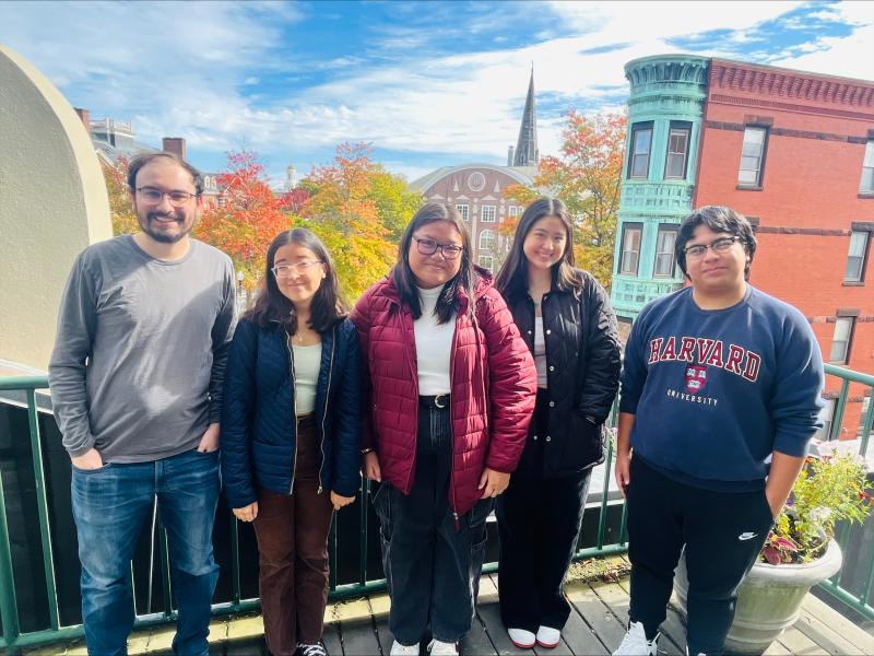 Five people standing for a photo