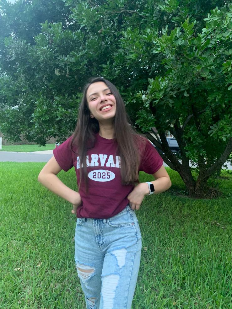 Ana during senior year wearing her new harvard Class of 2025 shirt. 