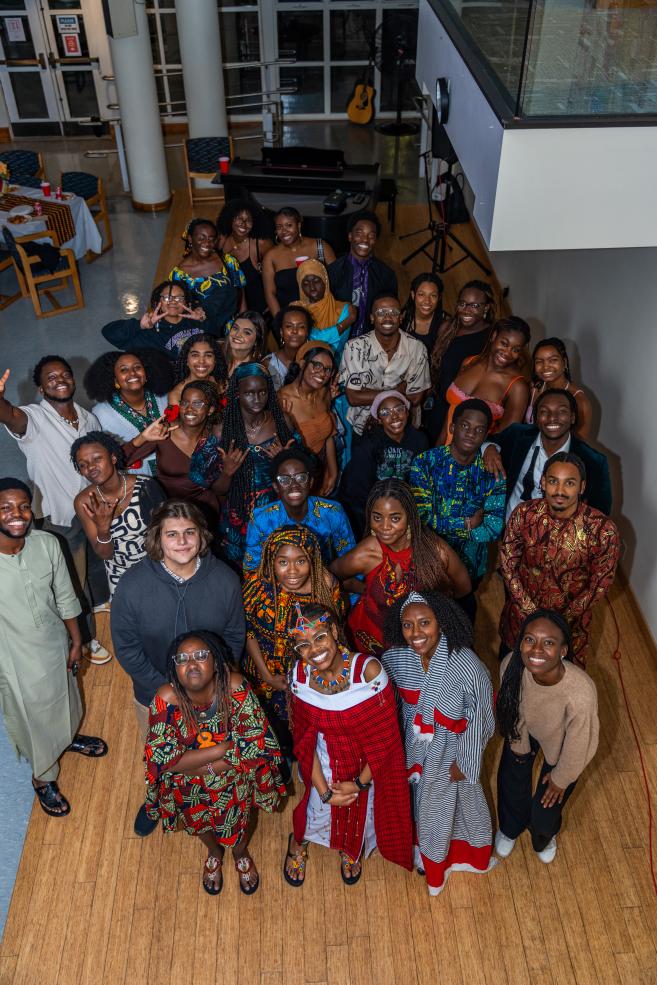 Attendees at the Harvard African Student Association Annual Fall Feast celebration pose for the camera.