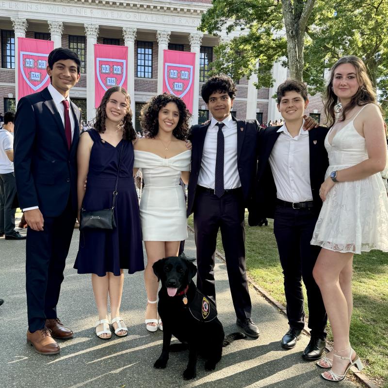 Our FOP group in front of Widener Library with Sasha the Harvard Police dog at Convocation