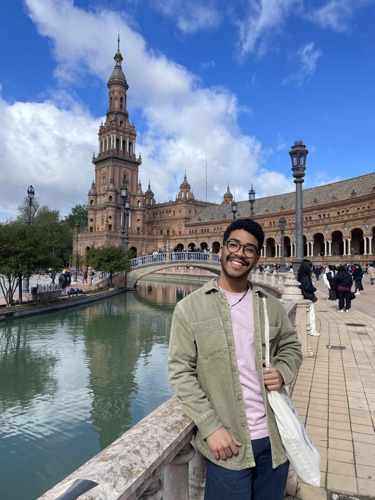 Jose standing in front of a cathedral in Plaza de Espana, Seville.