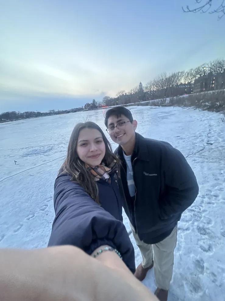 Bryant and Ana in a selfie, standing on the frozen Charles River.