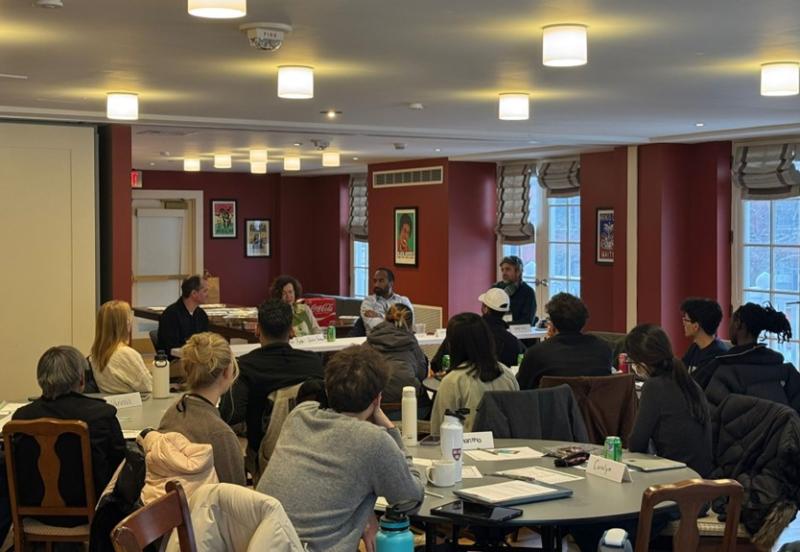 A group of people sitting at tables in a room