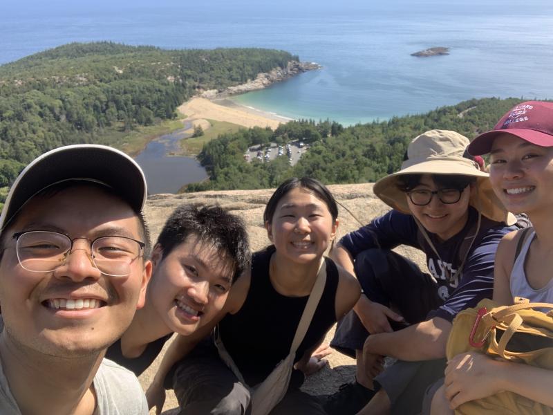 Group selfie picture of Raymond and his friends on a ledge of the Beehive Trail at Acadia National Park.