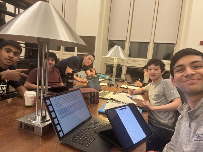 A group of students studies together in the Law School library