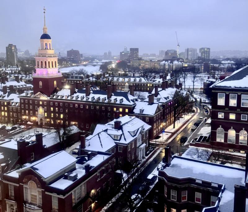 The view of Lowell House and the Charles River from the Smith Campus Center at sunset after a fresh snowfall.